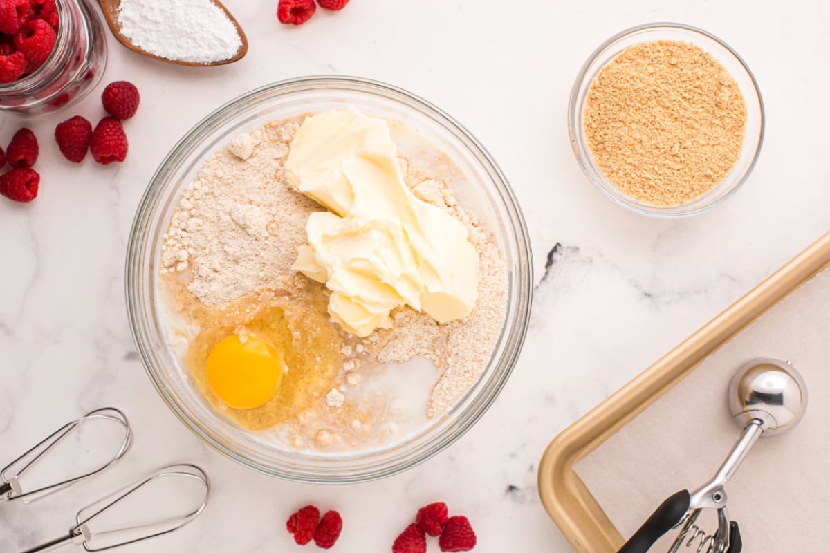 Softened cream, eggs and milk are placed in a bowl with the dry ingredients
