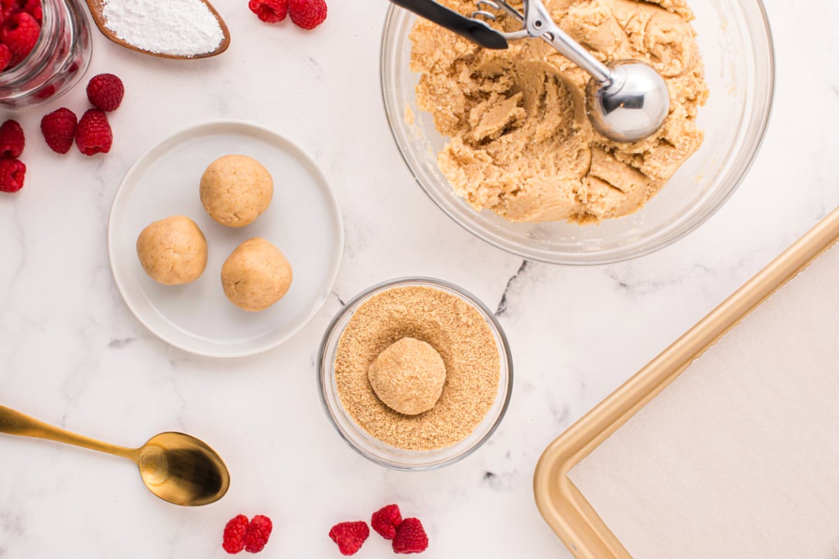 Roll cookie balls in graham cracker crumbs