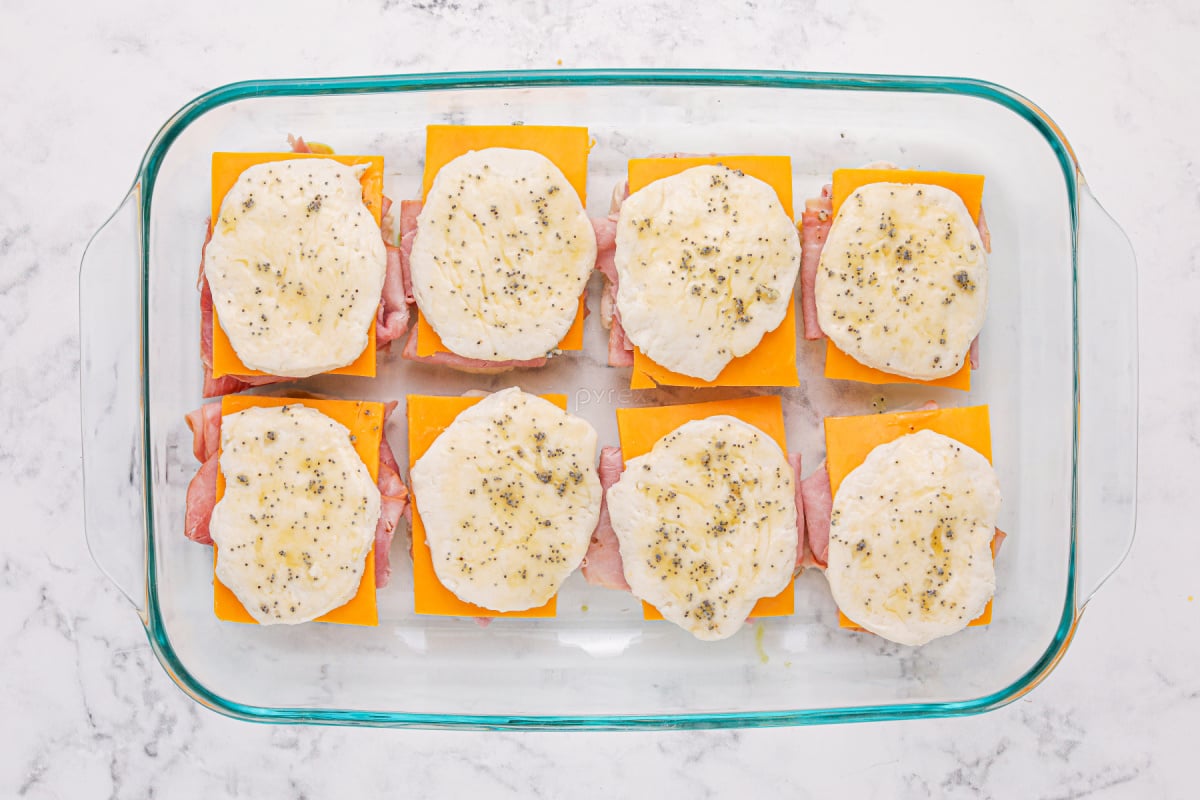 Poppy seed topping brushed on cookies