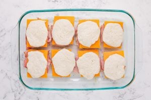 top biscuit placed on top of sliced cheese