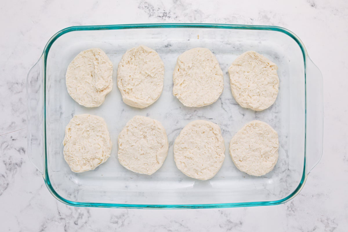 Place the bottom half of the cookie into the baking pan