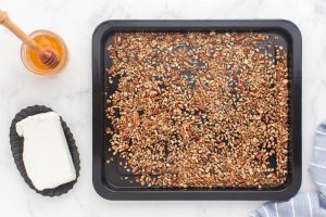 pecan pieces on a baking sheet