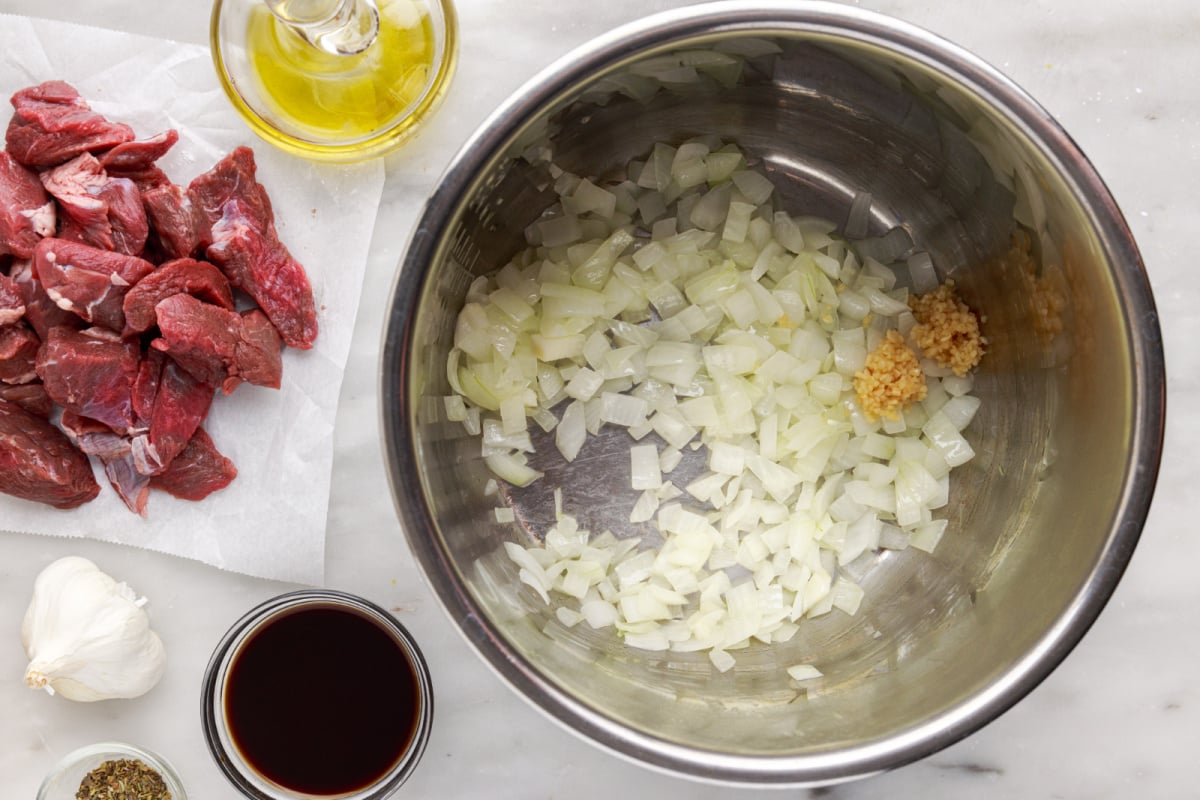 Add onions and garlic to the Instant Pot