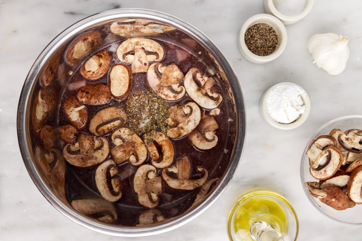 Add beef broth, red wine, Worcestershire sauce, sliced mushrooms, Italian seasoning, salt and black pepper to Instant Pot
