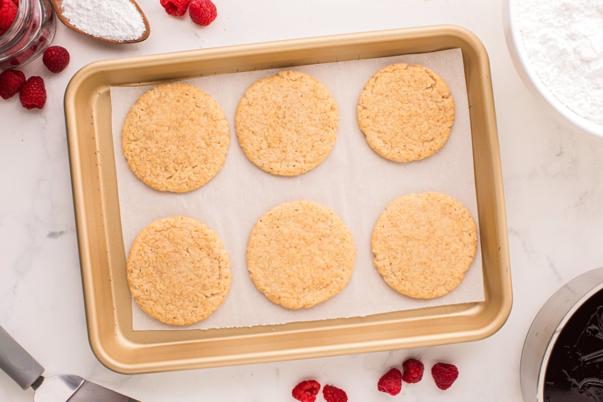 Place cooked biscuits on baking sheet
