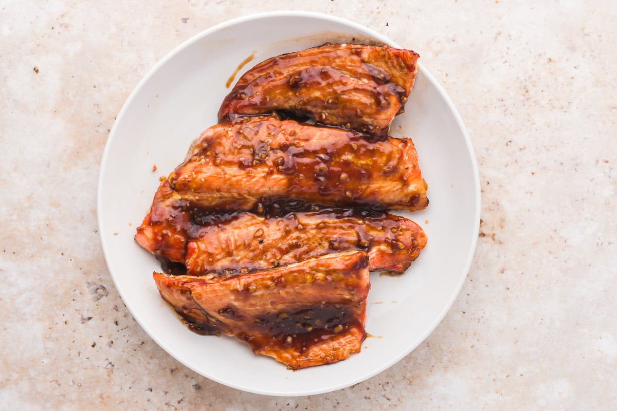 Smash sauce over salmon fillets