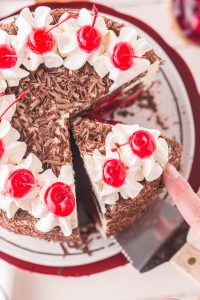 black forest cake with a slice being cut out