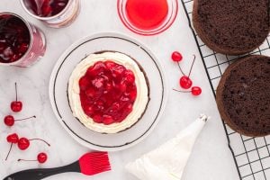 cherry filling added to middle of cake
