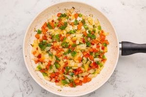 bell pepper and onion in a pan