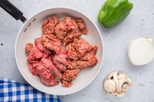 sausage and ground beef in a pan