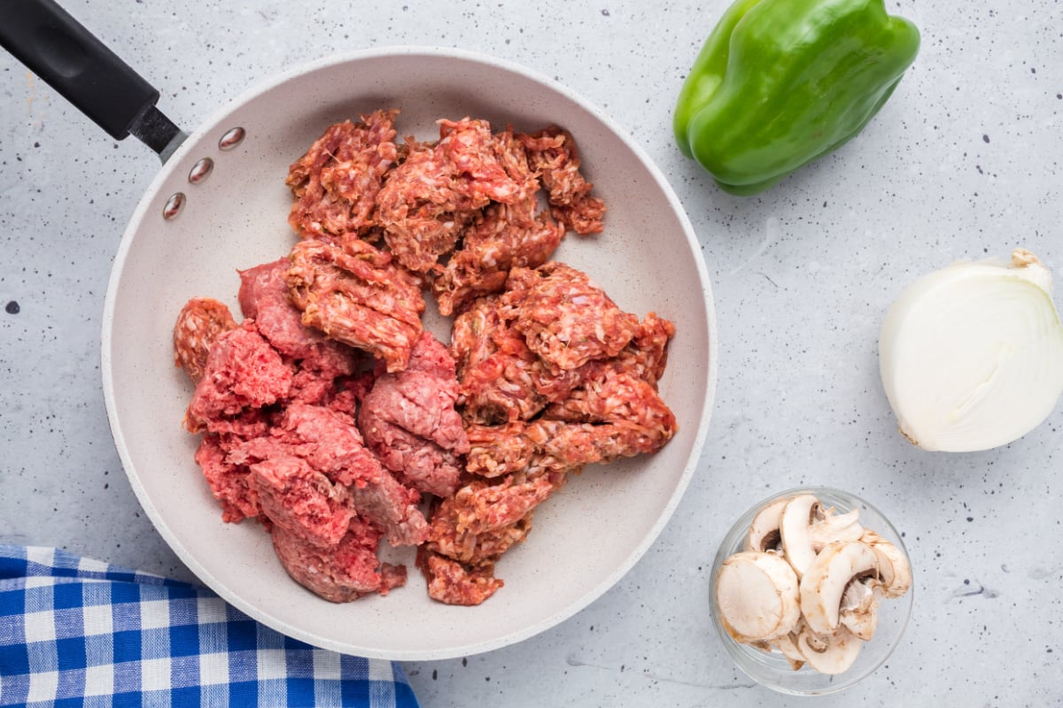 sausage and ground beef in a pan