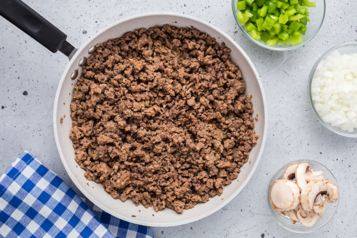 browned sausage and ground beef in a pan