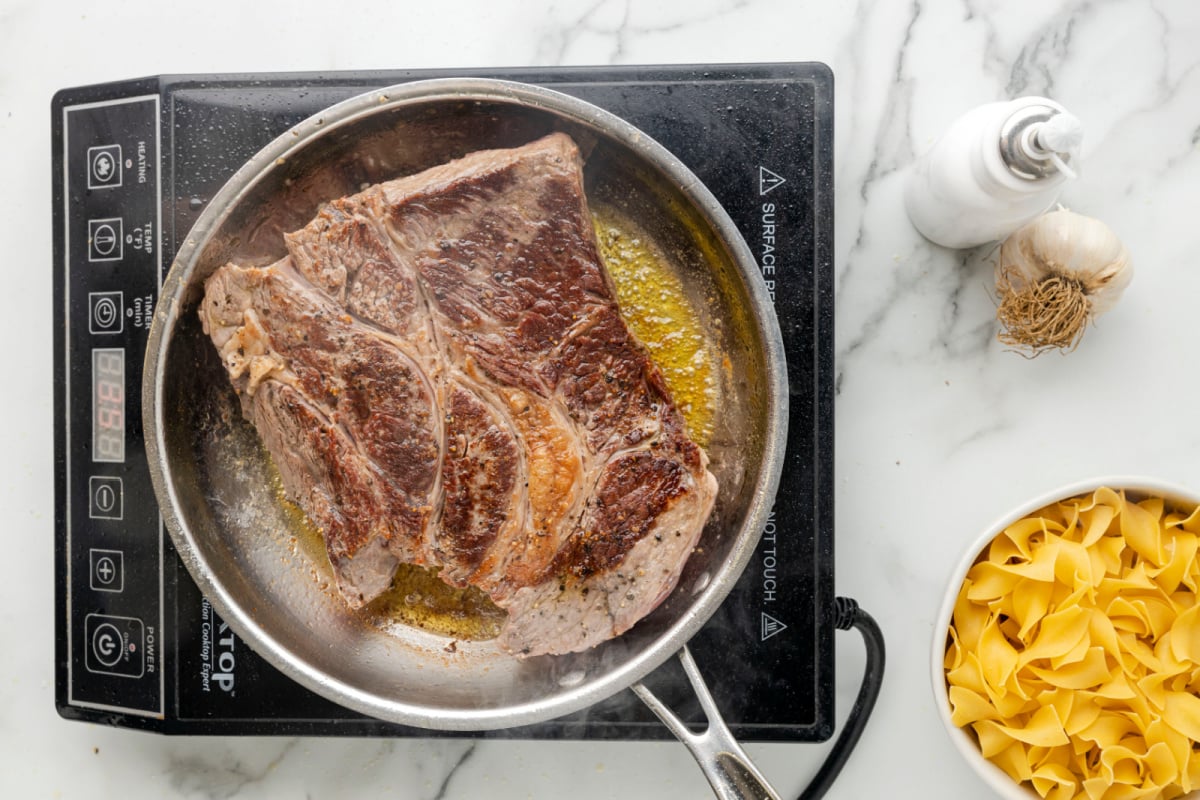 Fry beef in pan until browned