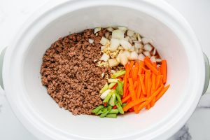 veggies and beef added to slow cooker