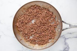 beef cooking in a pan