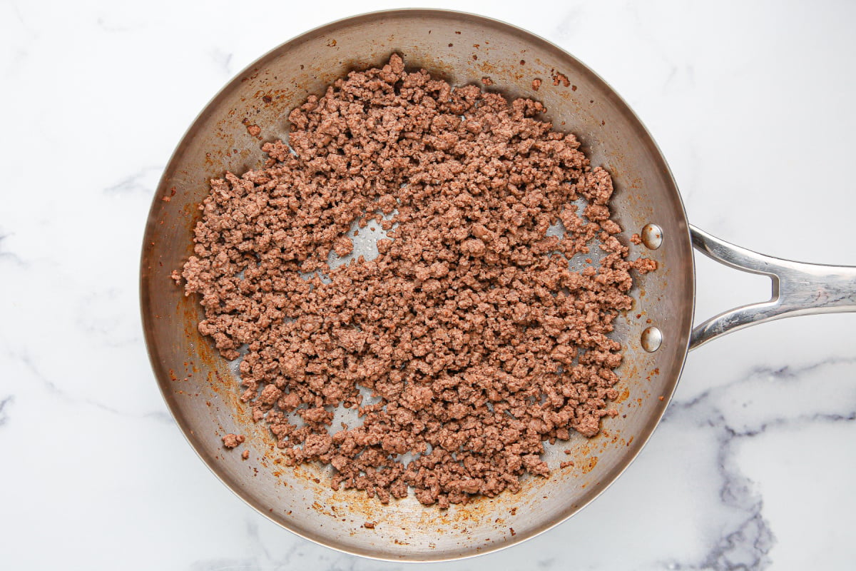beef cooking in a pan