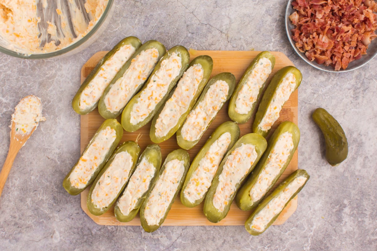 Stuffed Dill Pickles on a cutting board