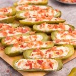 Stuffed Dill Pickles on a cutting board