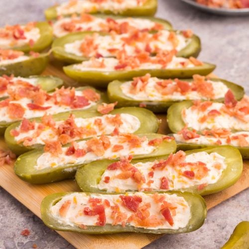Stuffed Dill Pickles on a cutting board
