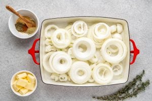 sliced onions in a baking dish