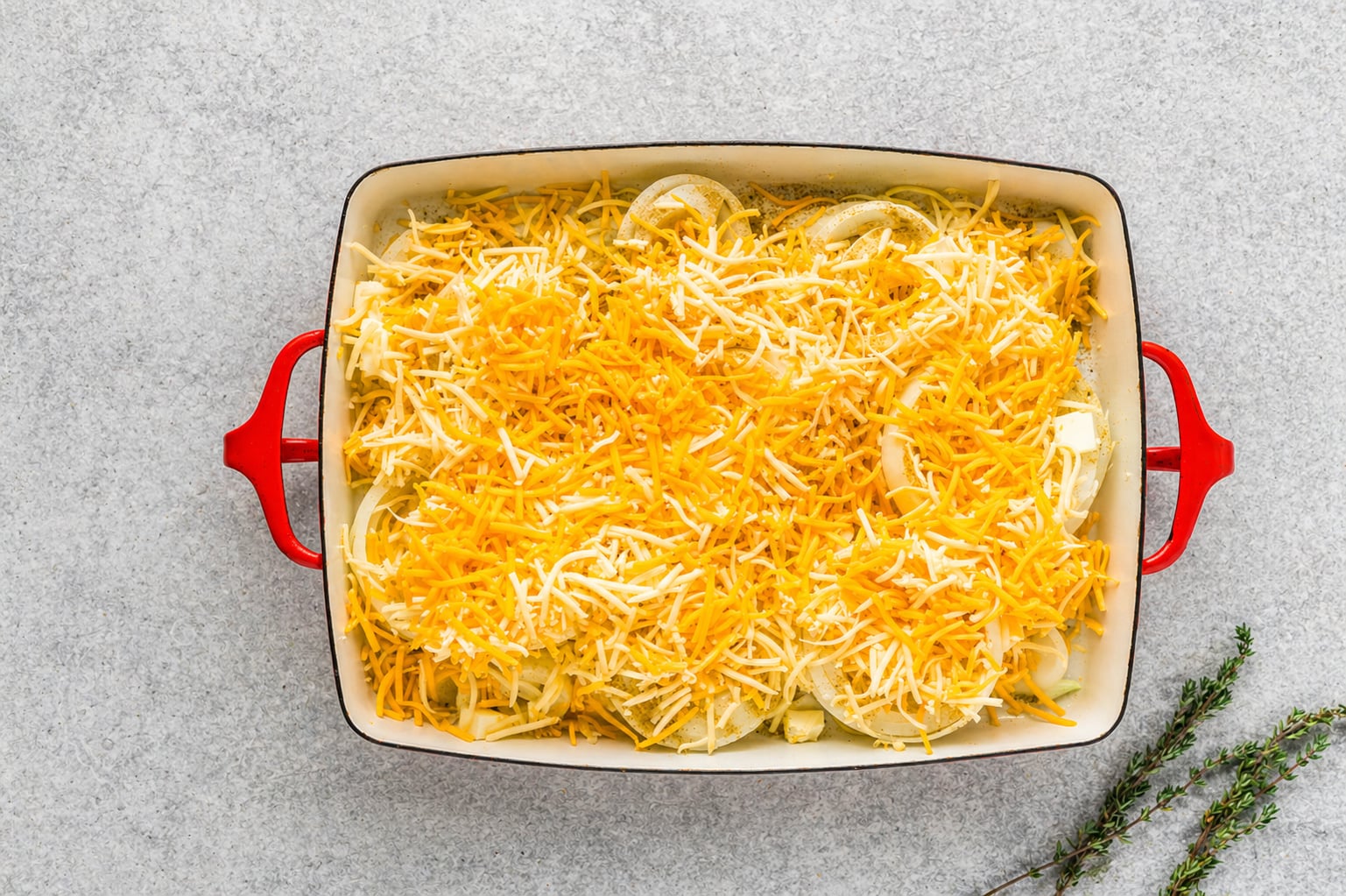 cheese sprinkled on top of onions