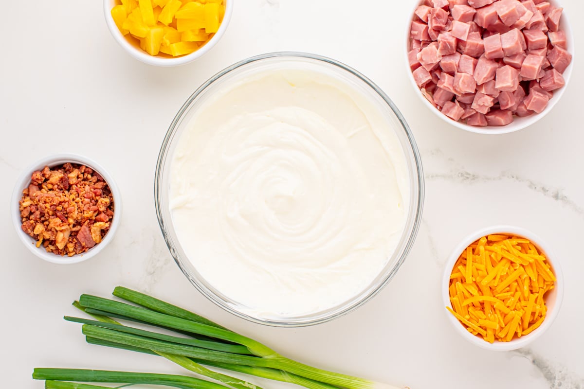 cream cheese, sour cream and reserved pineapple juice mixed in a bowl