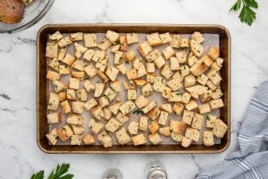 bread pieces placed on baking sheet