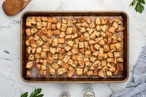 baked croutons on baking sheet