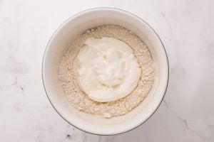 self-rising flour and the Greek yogurt in a bowl
