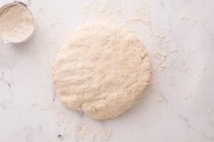 dough ball on a floured counter