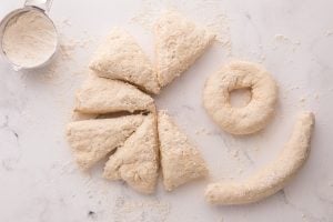 dough being rolled into bagel shape