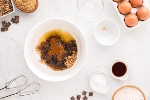 cooled butter, brown and white sugar in a large mixing bowl