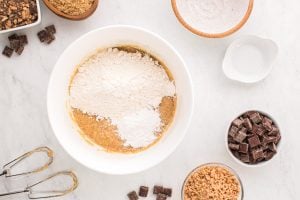 flour and baking powder added to bowl
