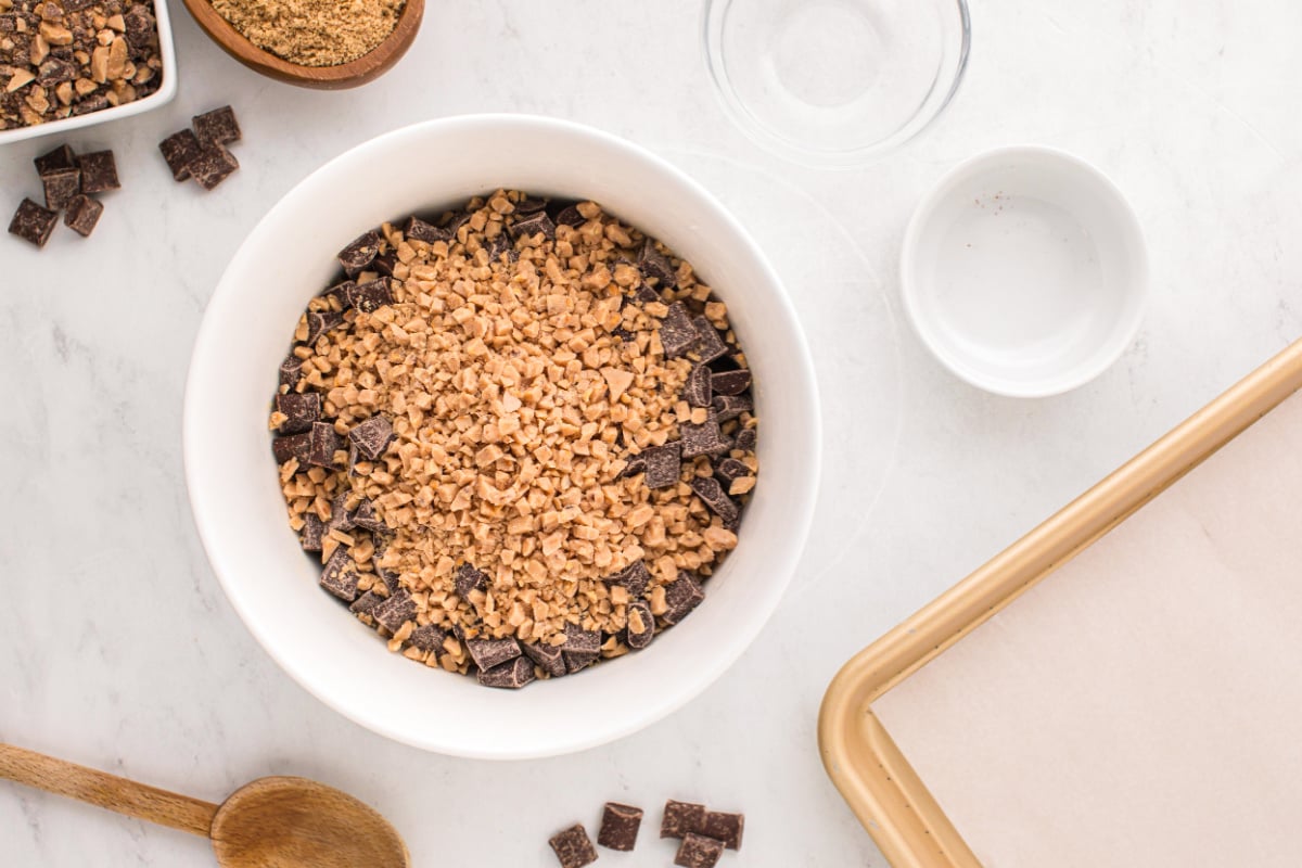 chocolate chunks and toffee pieces added to mixing bowl