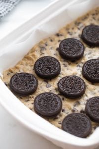 oreos placed on top of cookie dough