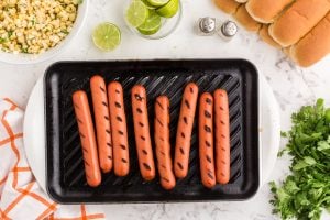 hot dogs on a grill