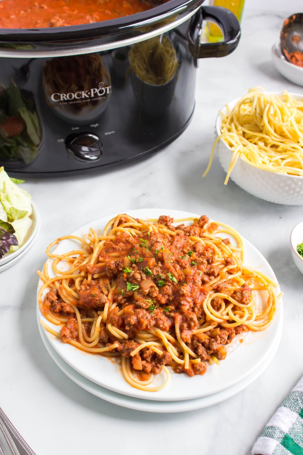 Slow Cooker Bolognese Sauce with pasta on a plate