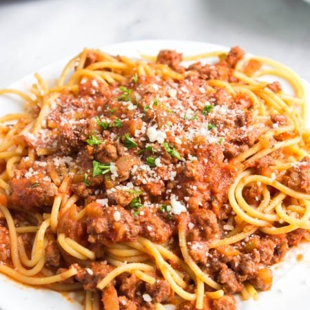 Slow Cooker Bolognese Sauce with pasta on a plate