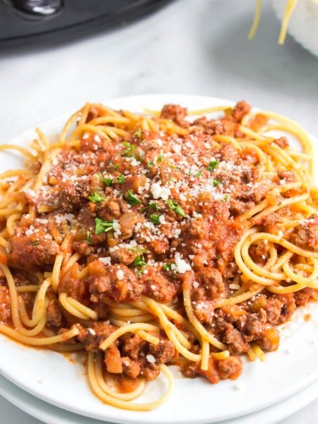 Slow Cooker Bolognese Sauce with pasta on a plate