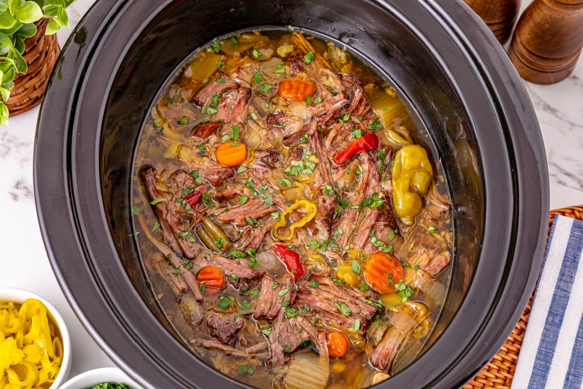 shredded beef placed back into slow cooker