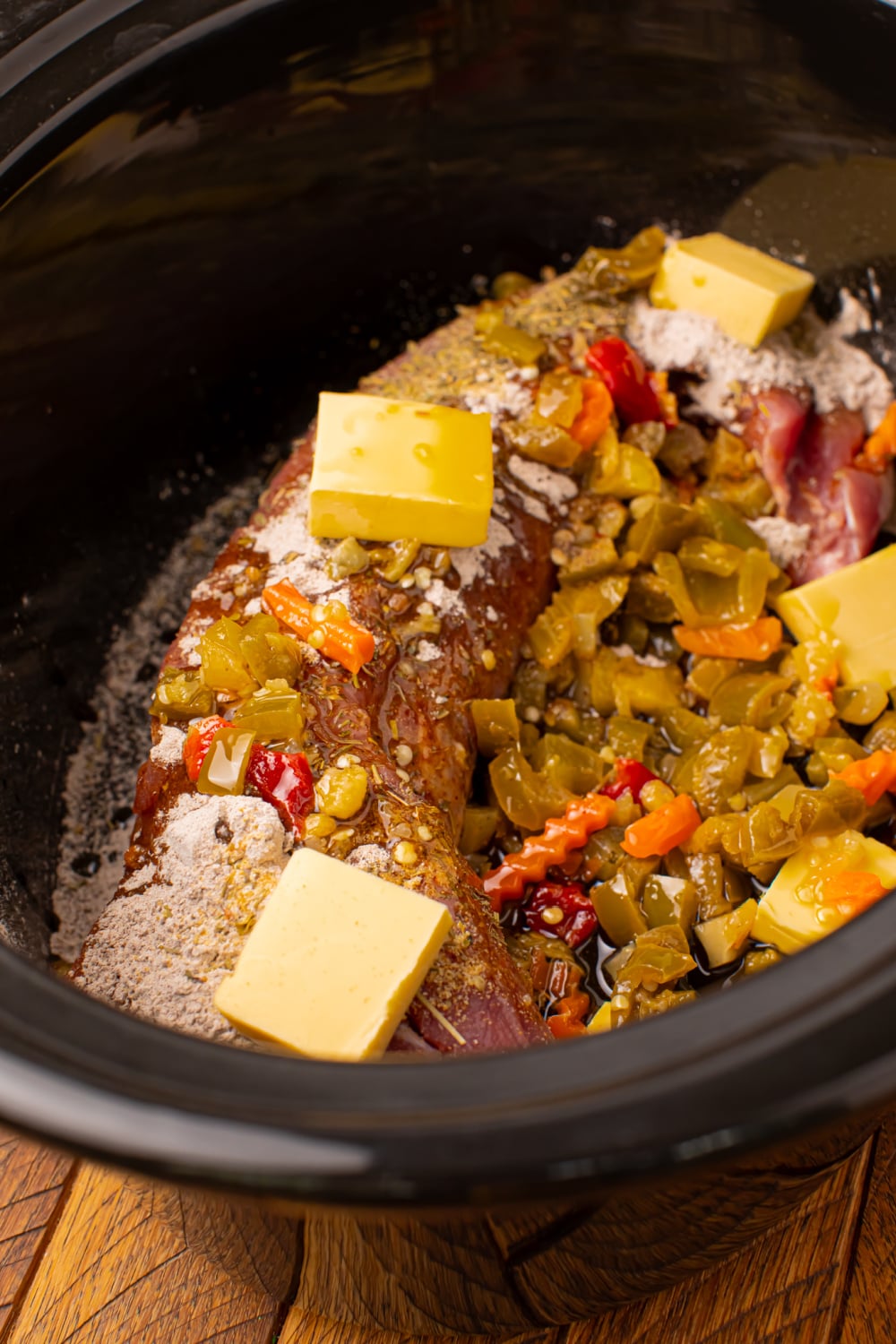 rained giardiniera and sliced butter pieces added to slow cooker