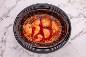 sauce added to crockpot with chicken