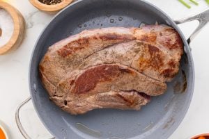 beef searing in a pan