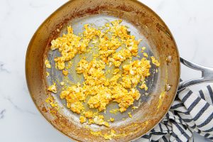 scramble eggs in a pan