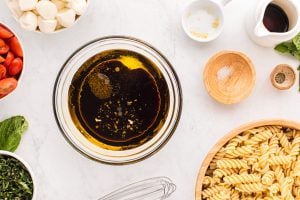 olive oil, balsamic vinegar, garlic, salt and pepper in a bowl