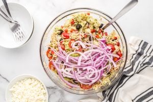 onions and dressing added to bowl