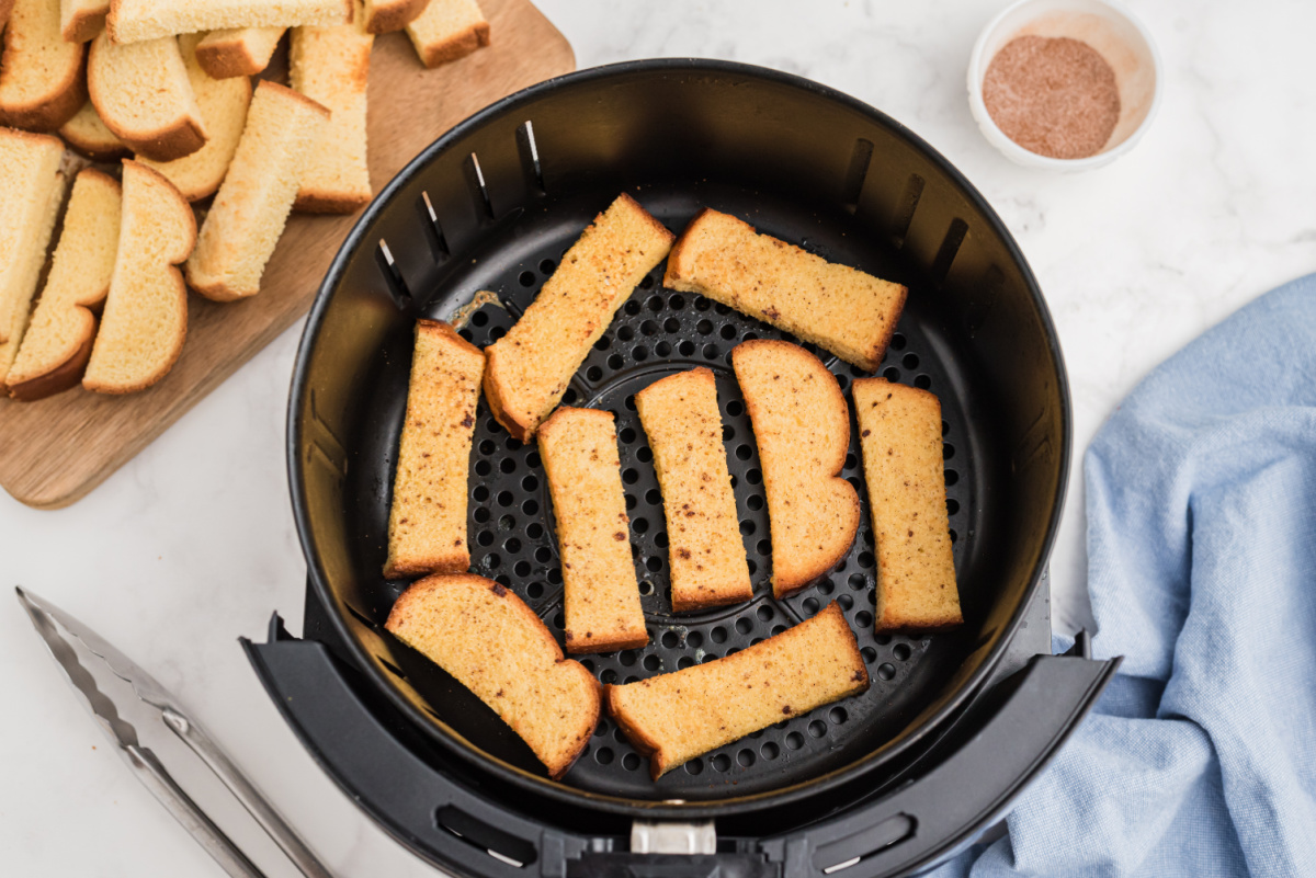 french toast stick in an air fryer basket