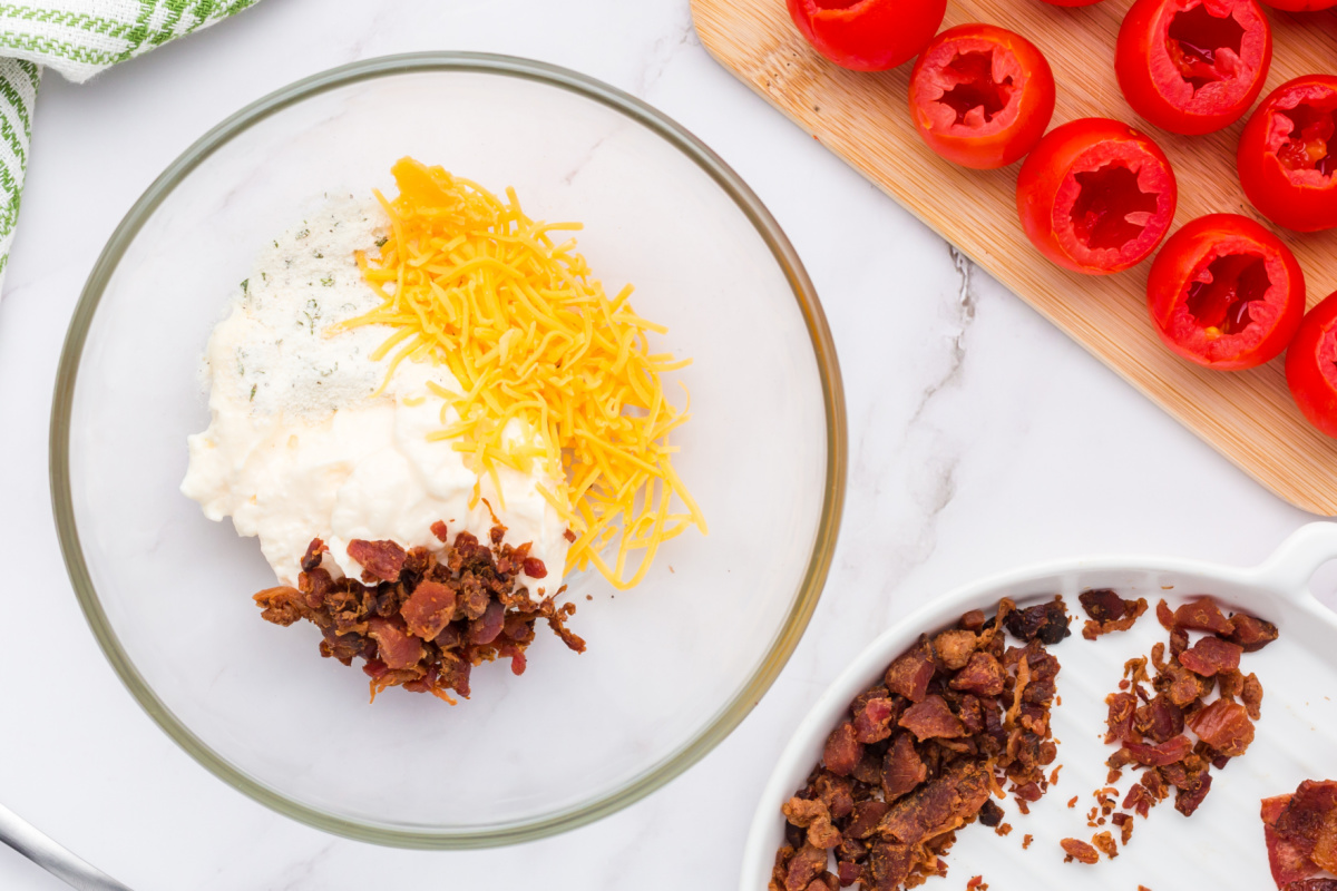 mayonnaise, ranch seasoning, shredded cheddar cheese, and bacon crumbles in a bowl