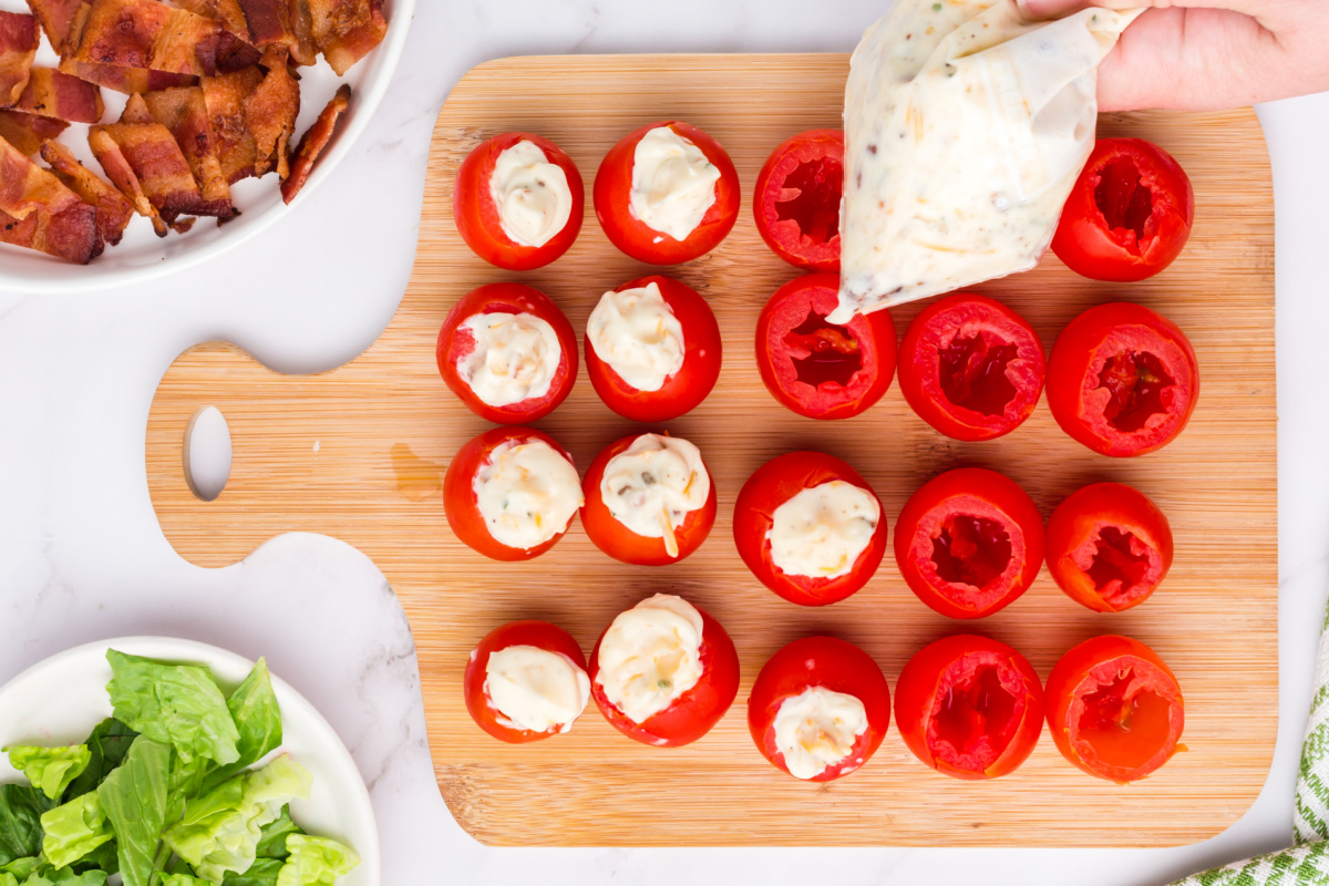 filling tomatoes with filling