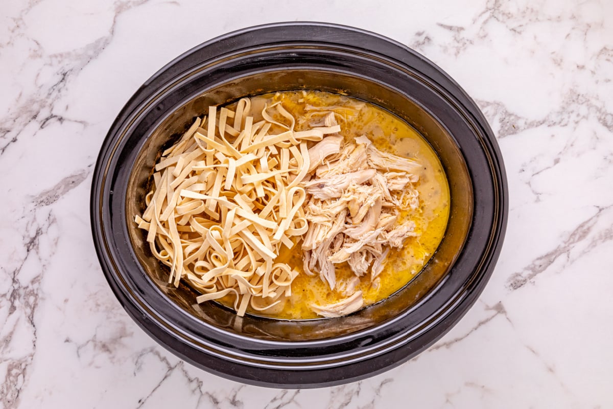 noodles and shredded chicken added to slow cooker